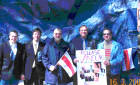 (from left) Paul Blocher and Andy Anuzis (office of Rep. Thaddeus McCotter), Ramunas Kondratas (JBANC), Frank Koszorus (American Hungarian Federation) , Karl Altau (JBANC). and the Belarus "denim Freedom flag" 