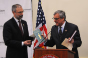 Paul Kamenar presents Congressman Harris with rare books on Lajos Kossuth