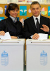 Chairman of the conservative party, the Fidesz - Hungarian Civic Alliance and prime minister candidate Viktor Orban (R) and his wife Aniko Levai (C) cast their vote at a polling station in Budapest, Hungary, 11 April. Photo exceprt from a larger image by EPA/BGNES