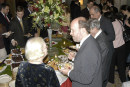 AHF's Maria Schottentstein with Slovak Ambassador Rastislav Kacer sampling the buffet at the State Department reception in honor of the 1956 Hungarian Revolution [© Bryan Dawson-Szilagyi, AHF News Service]