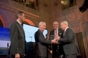 Sylvester Vizi presented the award to Co-President Gyula Elemér Balogh who accepted the award on behalf of the Federation