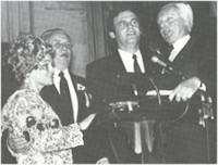 Left to Right: Ms. Anette Lantos, Rev. Imre Bertalan, Laszlo TOkes, and Congressman Tom Lantos sing a Hungarian folk song at the conclusion of the ceremony